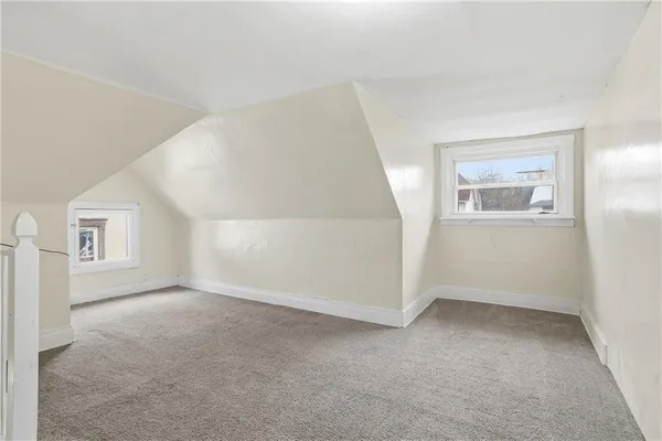 a view of empty room with windows