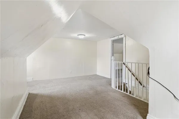 a view of an empty room with stairs