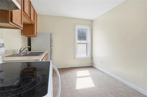 a kitchen with a sink and a stove