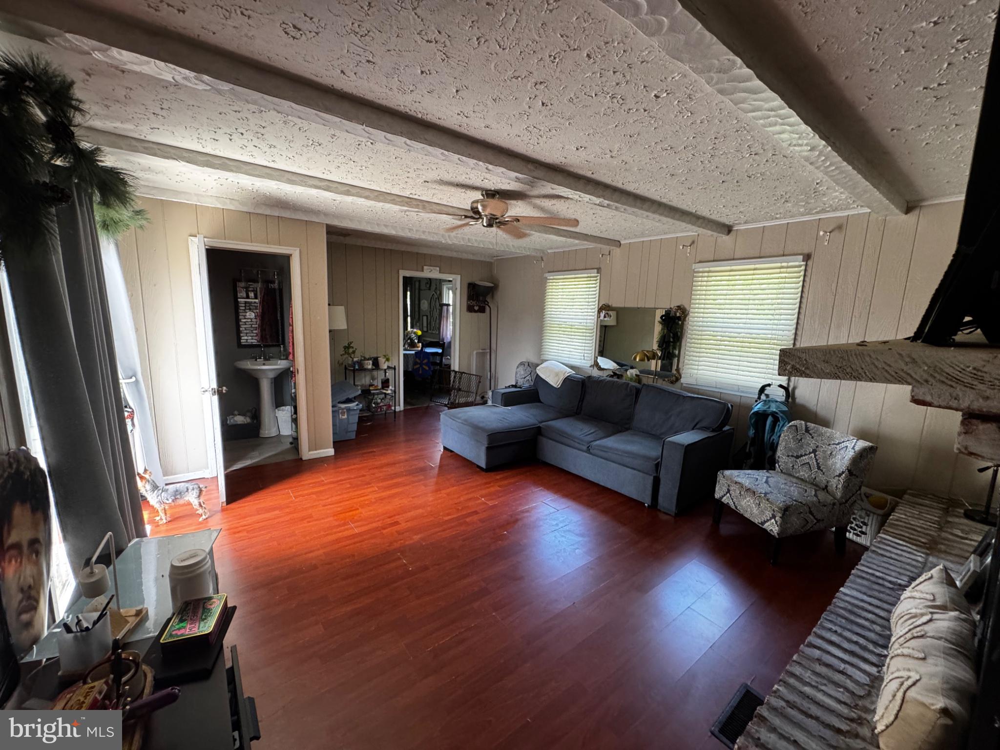 54 Warwick Road Stratford, NJ 08084 - Photo 16 of 20 Spacious living area with warm tones.