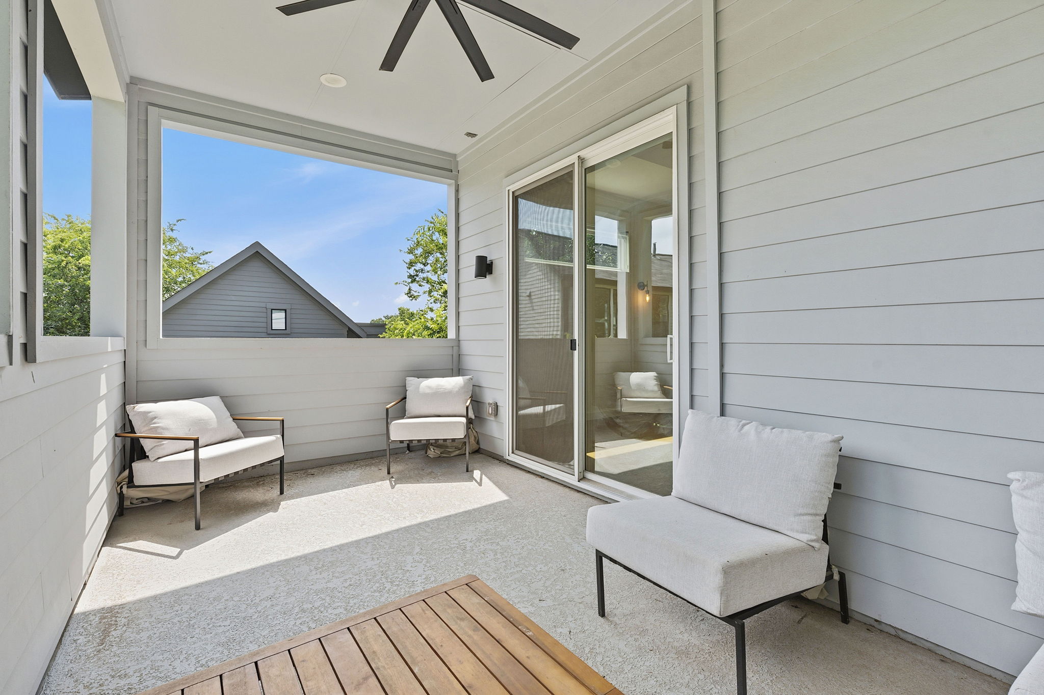 1707 Deloney Street, Unit 2 Austin, TX 78721 - Photo 5 of 26 An inviting covered patio provides a tranquil outdoor retreat with ample space for relaxation.