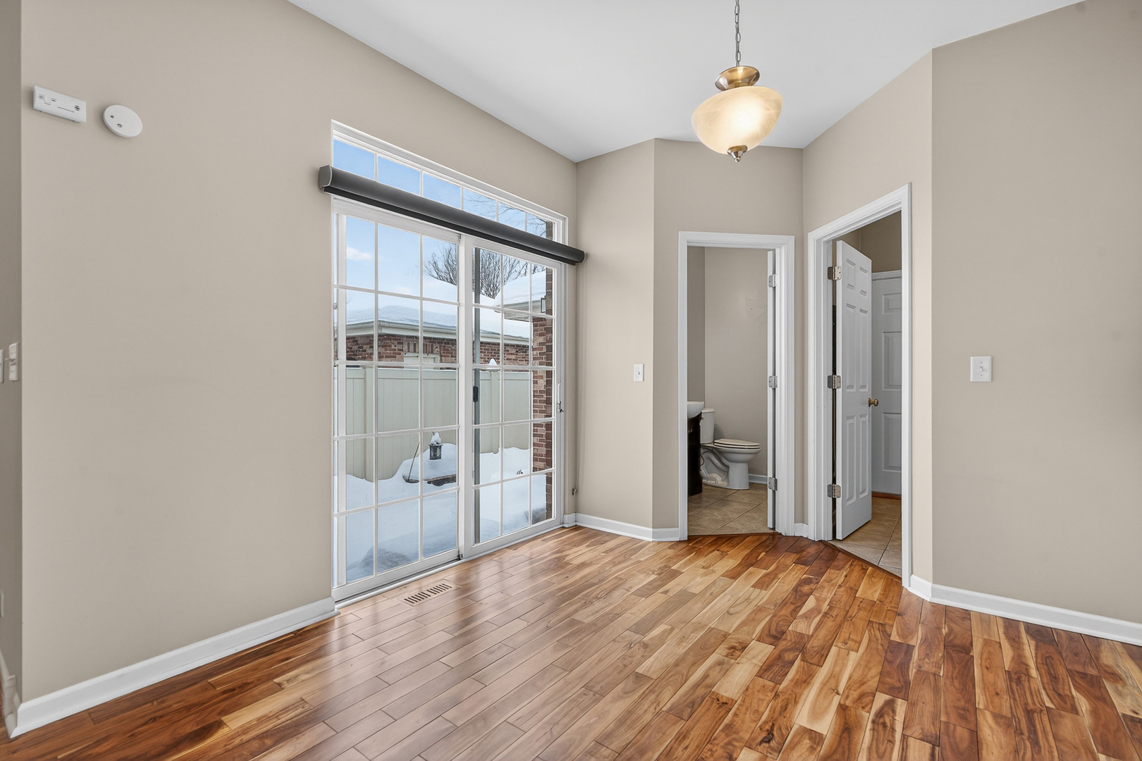 234 Longview Drive Elgin, IL 60124 - Photo 14 of 37 wooden floor in an empty room with a window