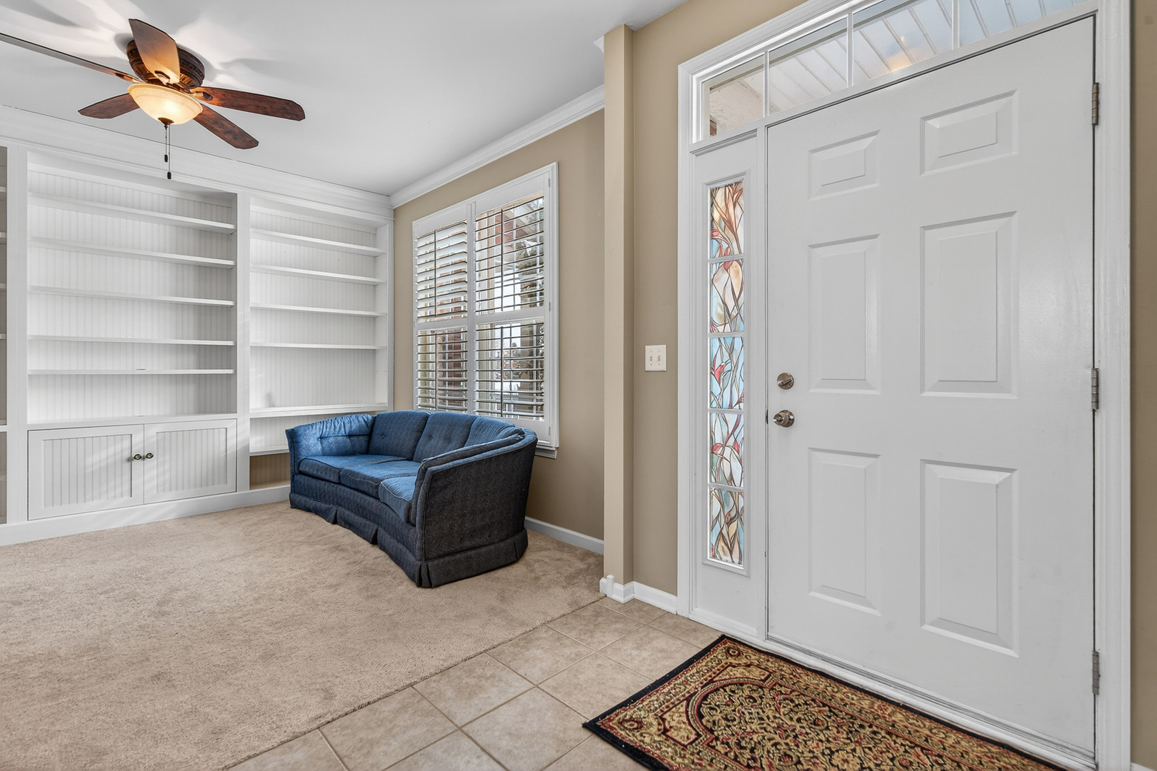 234 Longview Drive Elgin, IL 60124 - Photo 19 of 37 a living room with furniture and a window