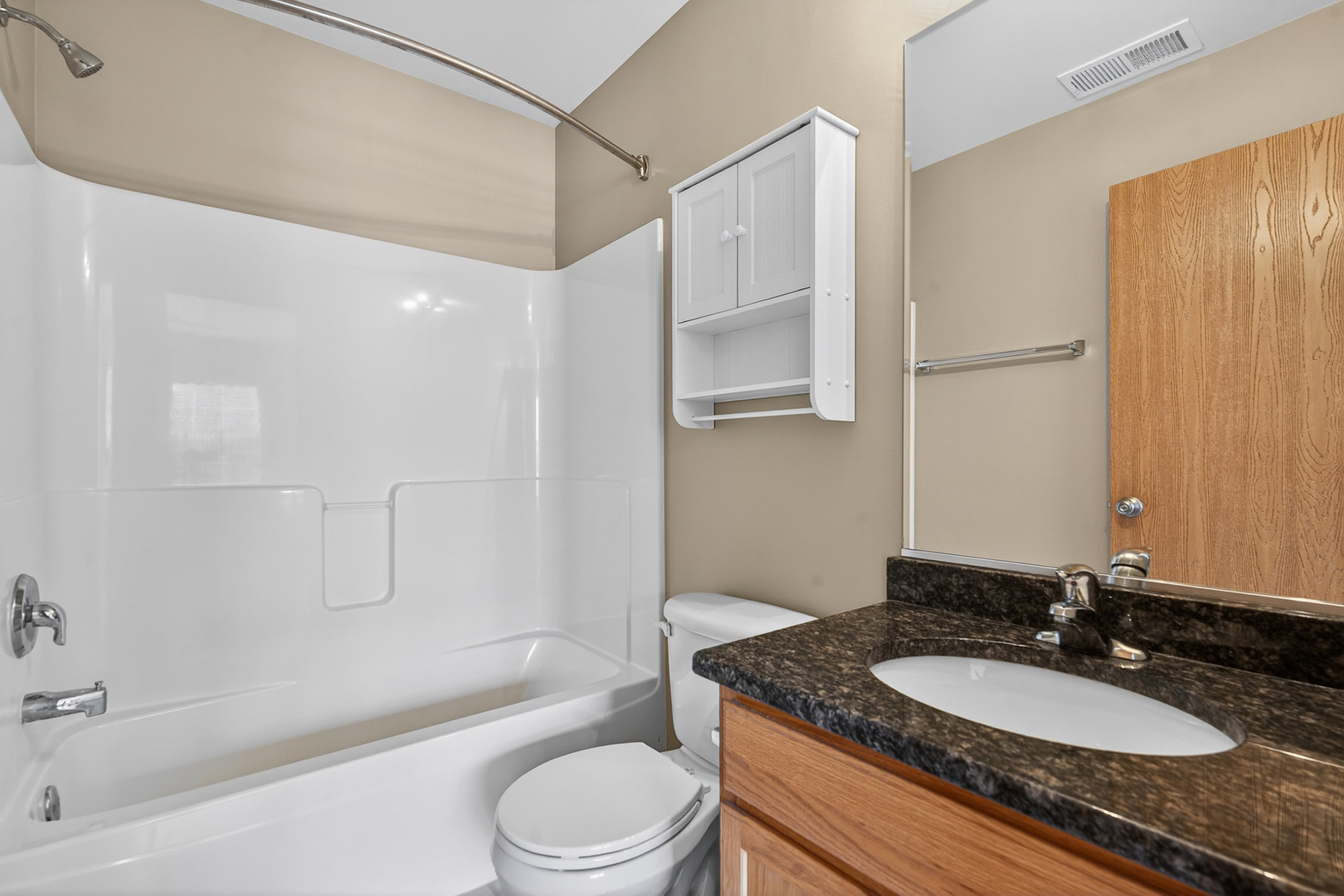 234 Longview Drive Elgin, IL 60124 - Photo 30 of 37 a bathroom with a granite countertop sink toilet a mirror and shower