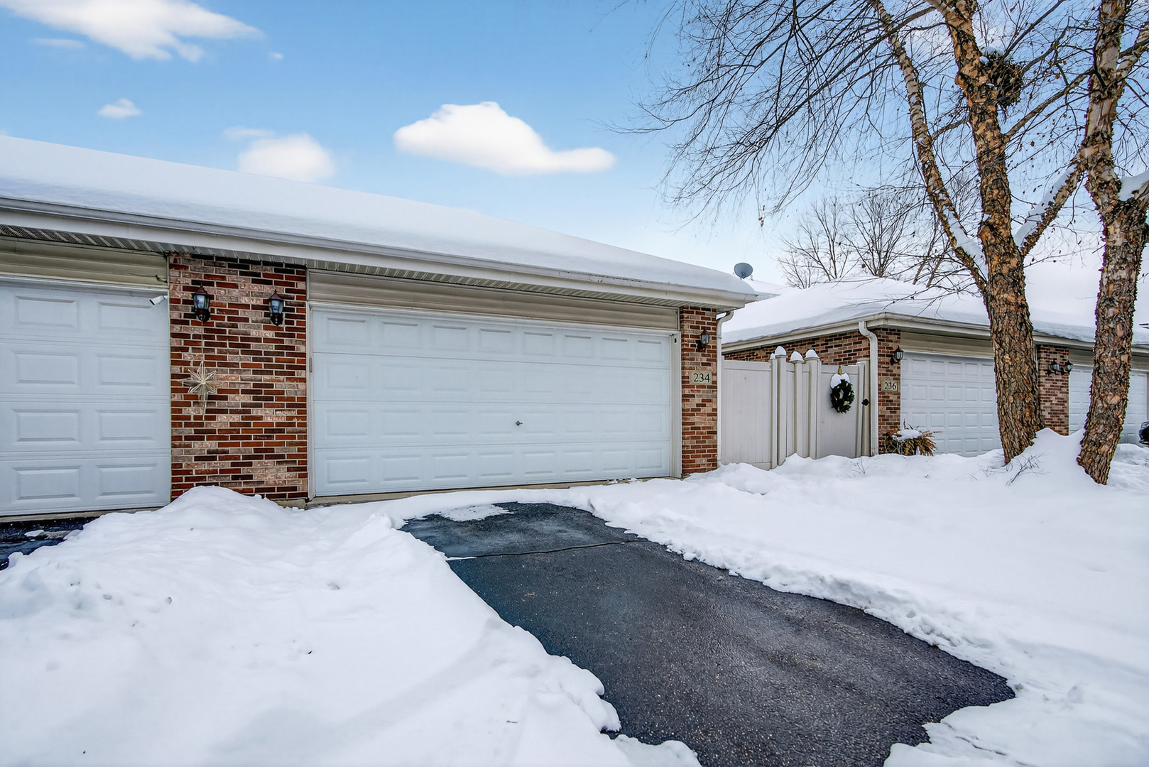 234 Longview Drive Elgin, IL 60124 - Photo 35 of 37 a front view of a house with a yard and garage