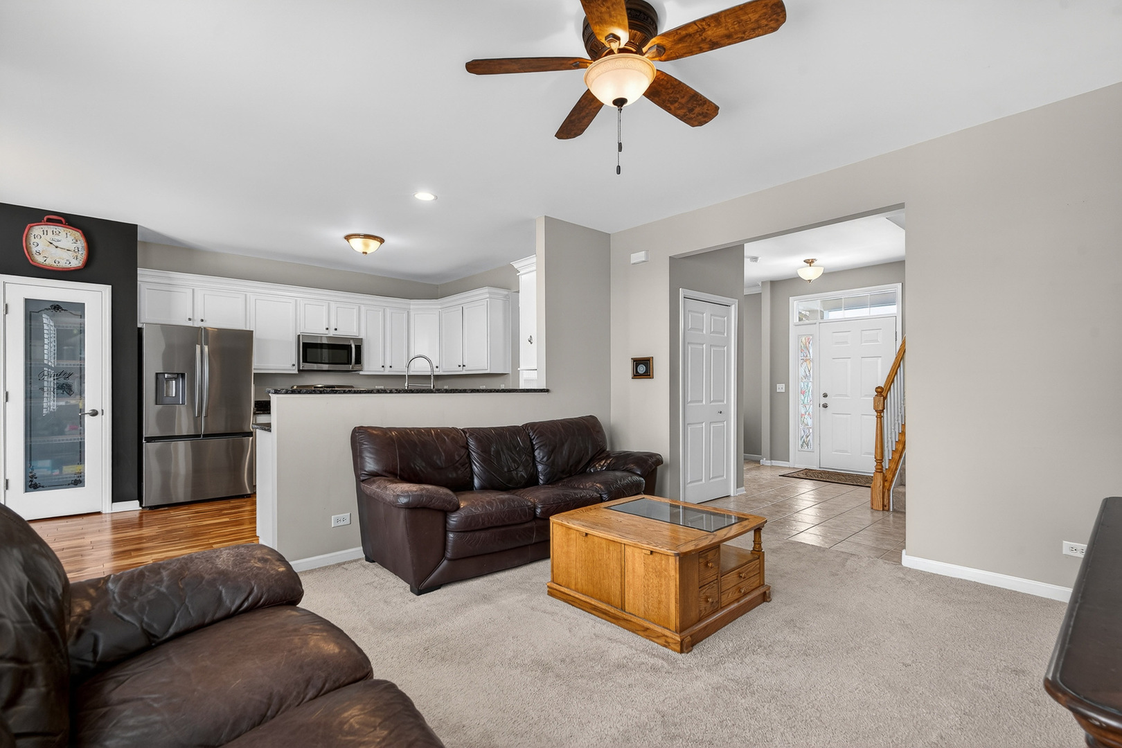 234 Longview Drive Elgin, IL 60124 - Photo 7 of 37 a living room with stainless steel appliances kitchen island granite countertop furniture and a view of kitchen