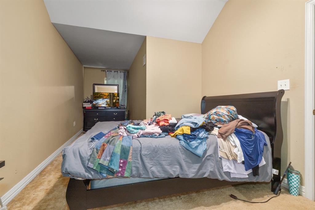 20 Addi Lane Waco, TX 76705 - Photo 21 of 24 a bed sitting in a bedroom next to a window