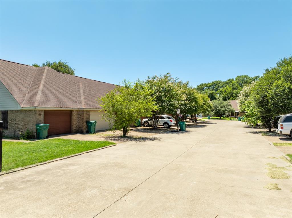 20 Addi Lane Waco, TX 76705 - Photo 8 of 24 a view of a house with a yard and tree