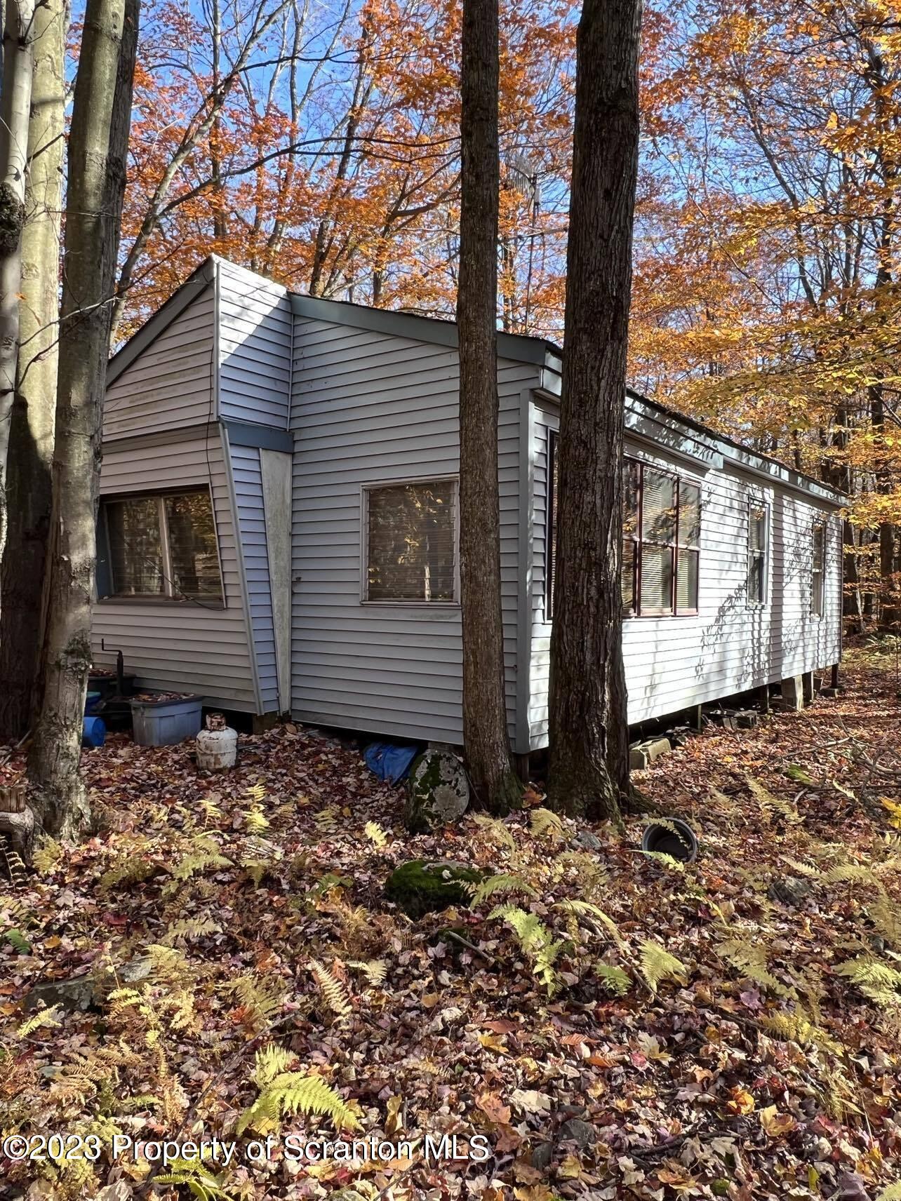 31 Blue Sky Path Gouldsboro, PA 18424 - Photo 5 of 12 a view of a house with a yard