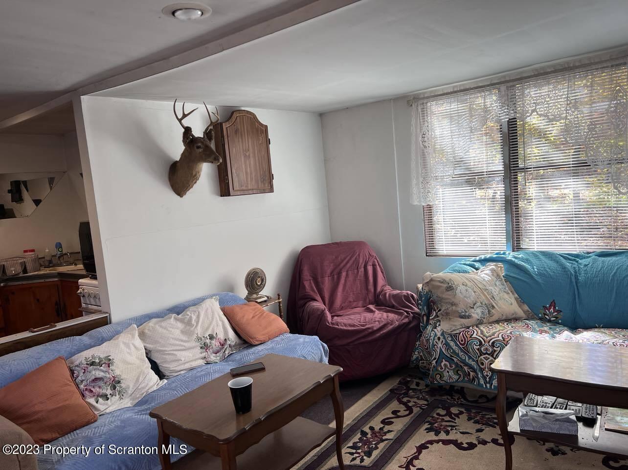 31 Blue Sky Path Gouldsboro, PA 18424 - Photo 7 of 12 a living room with furniture and a window