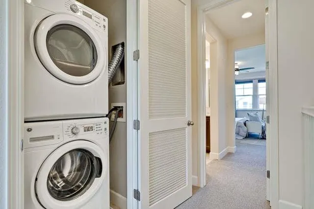 a view of a hallway with washer and dryer