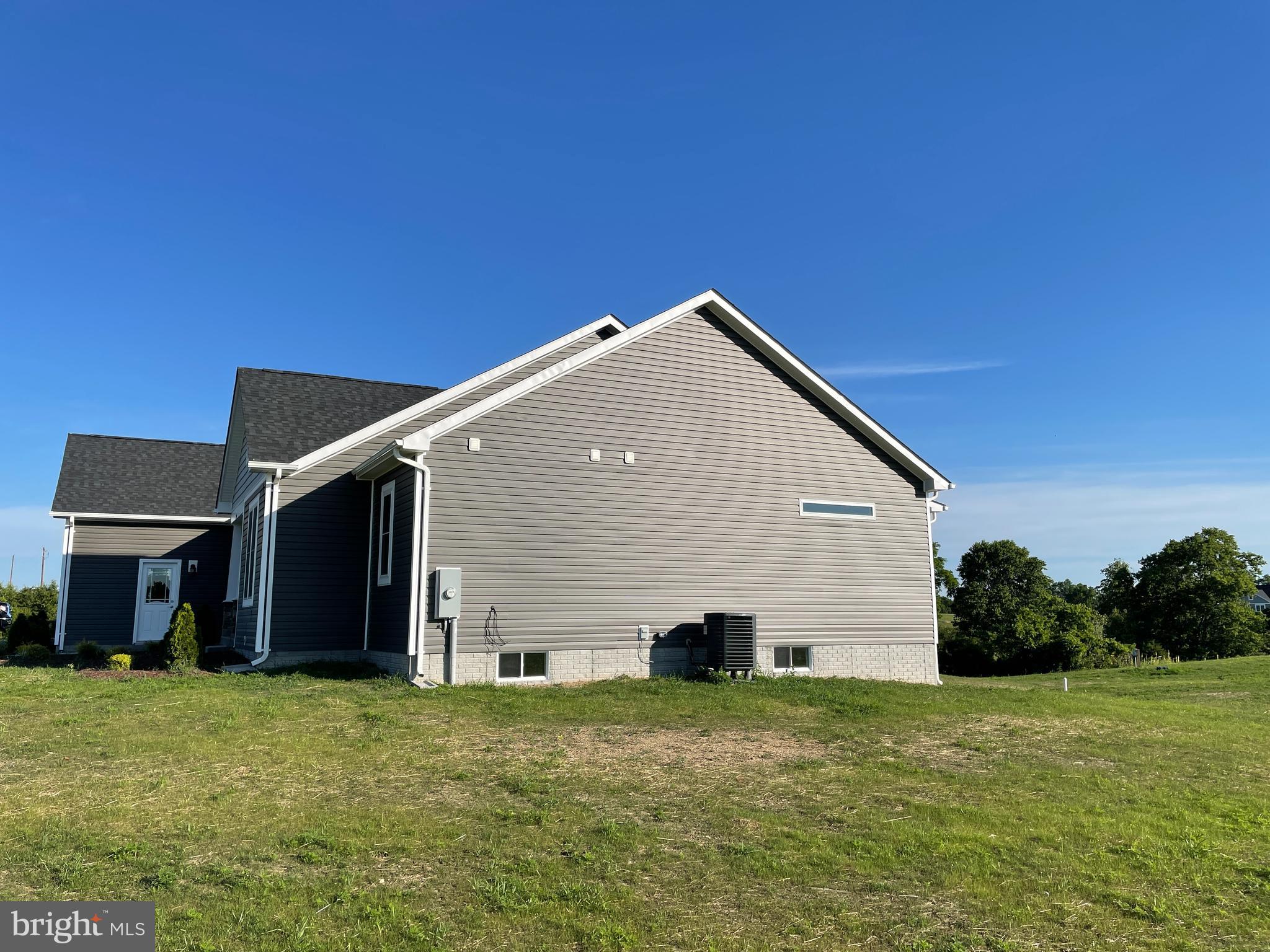 7 Redbud Road Winchester, VA 22603 - Photo 2 of 25 a backyard of a house with lots of green space