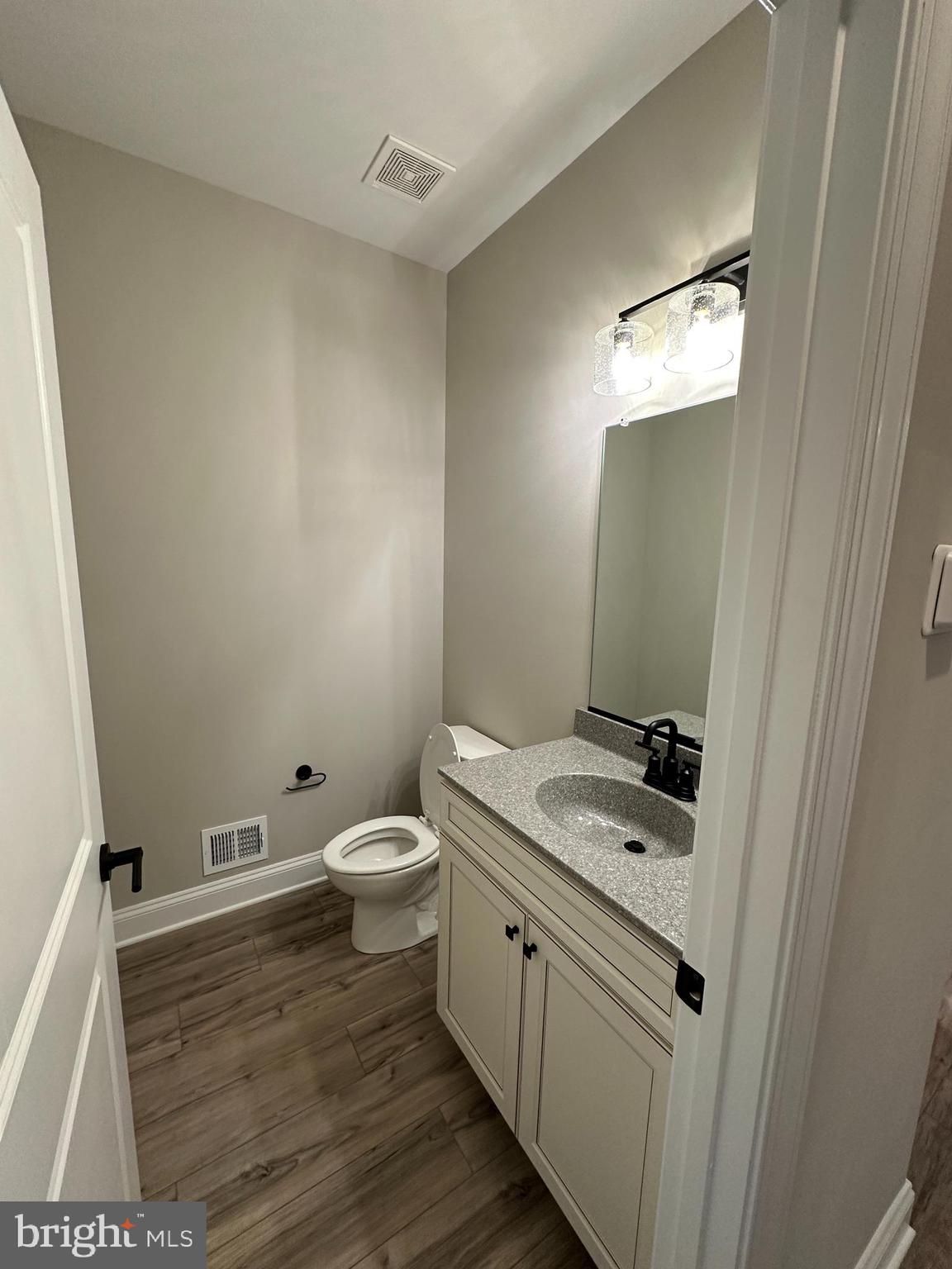 7 Redbud Road Winchester, VA 22603 - Photo 24 of 25 a bathroom with a granite countertop toilet and sink