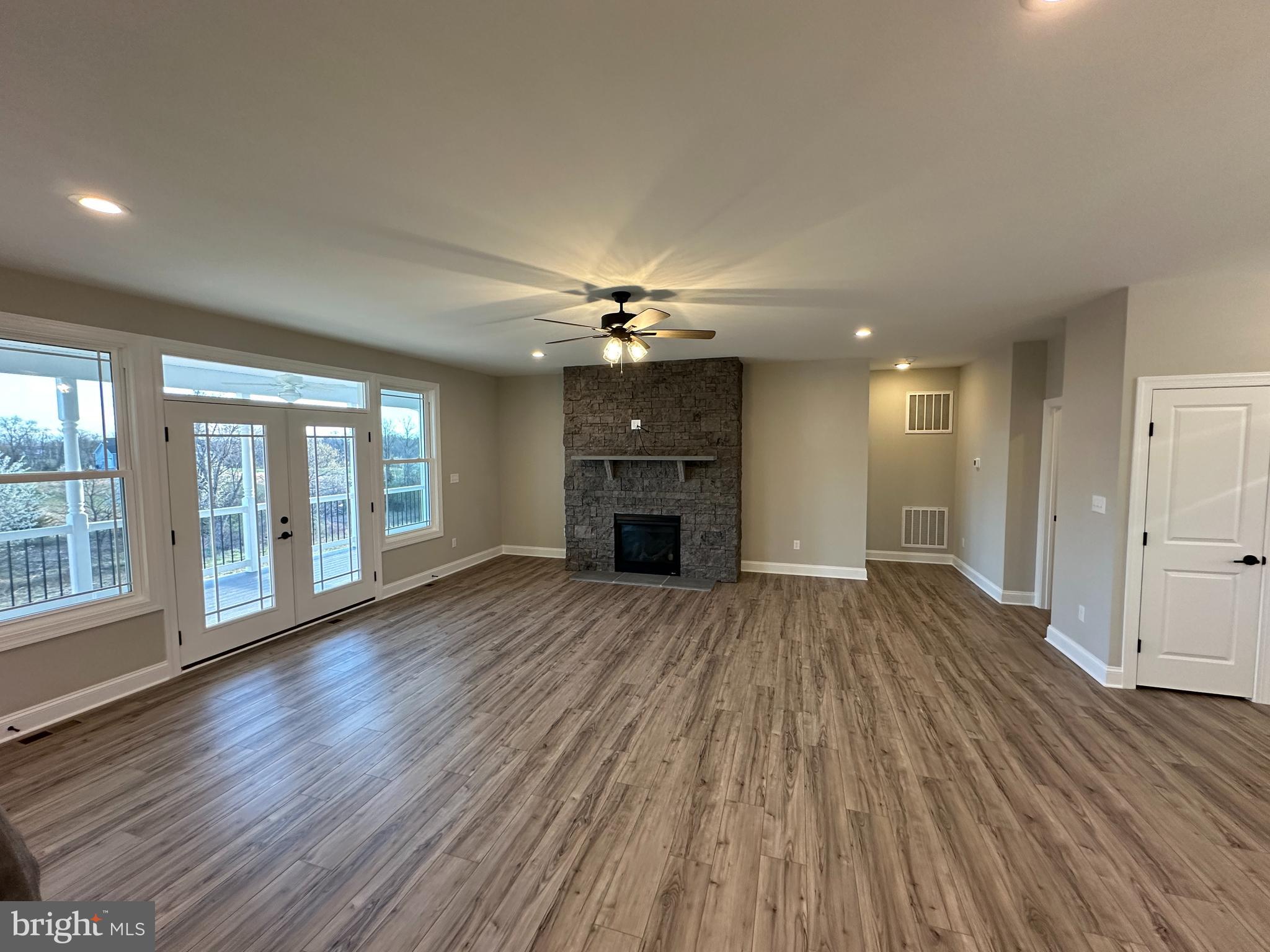 7 Redbud Road Winchester, VA 22603 - Photo 6 of 25 a view of an empty room with wooden floor and a window