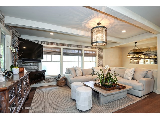 1718 Harding Road Northfield, IL 60093 - Photo 2 of 10 a living room with furniture and a flat screen tv