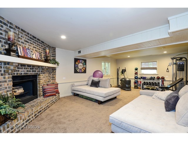 1718 Harding Road Northfield, IL 60093 - Photo 4 of 10 a living room with furniture and a fireplace
