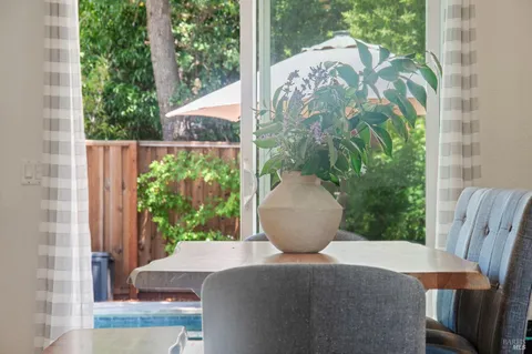 a view of a porch with furniture and garden