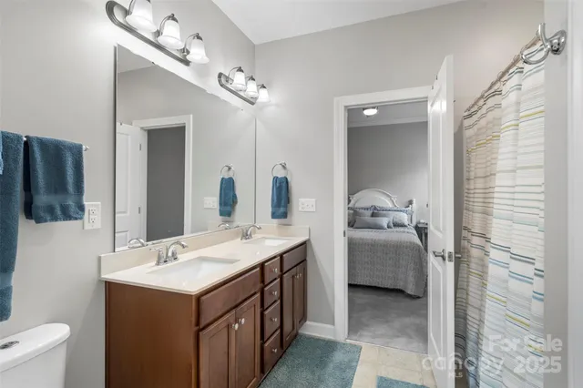 a bathroom with a double vanity sink a and mirror