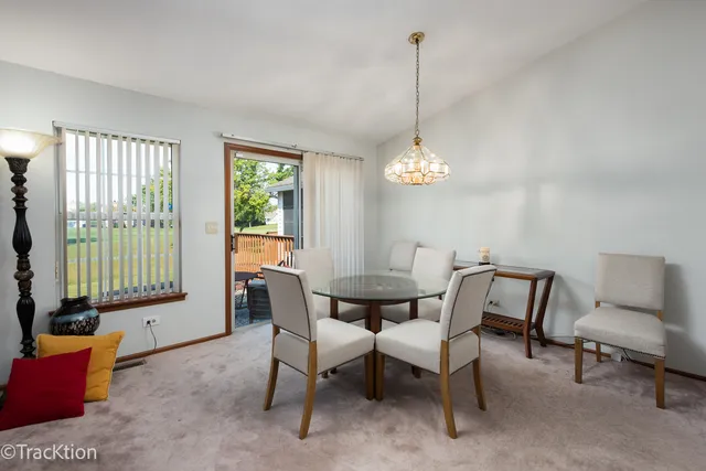 a bedroom with a bed and a lamp