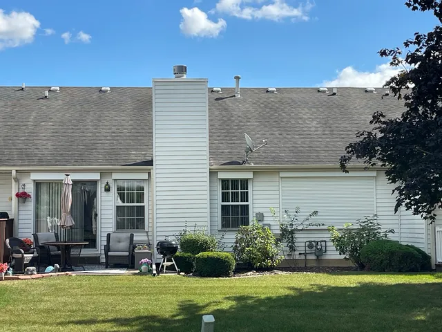 a view of a park with large trees