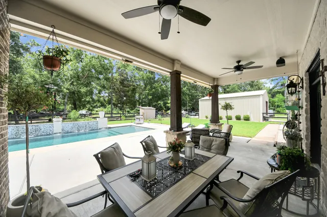 a garden with trees in the background
