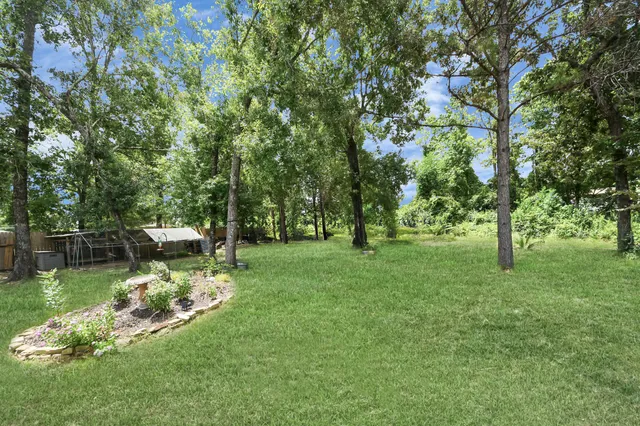 a view of a hallway to a livingroom and a wooden floor