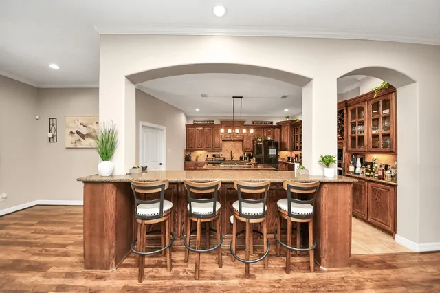 a kitchen with stainless steel appliances granite countertop a stove oven and a refrigerator