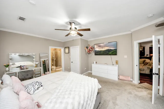 a en suite bathroom with a granite countertop sink and a mirror