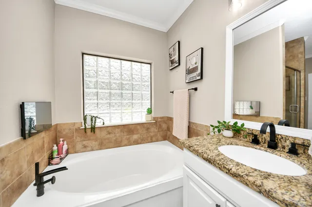 a living room with furniture and a gym machine