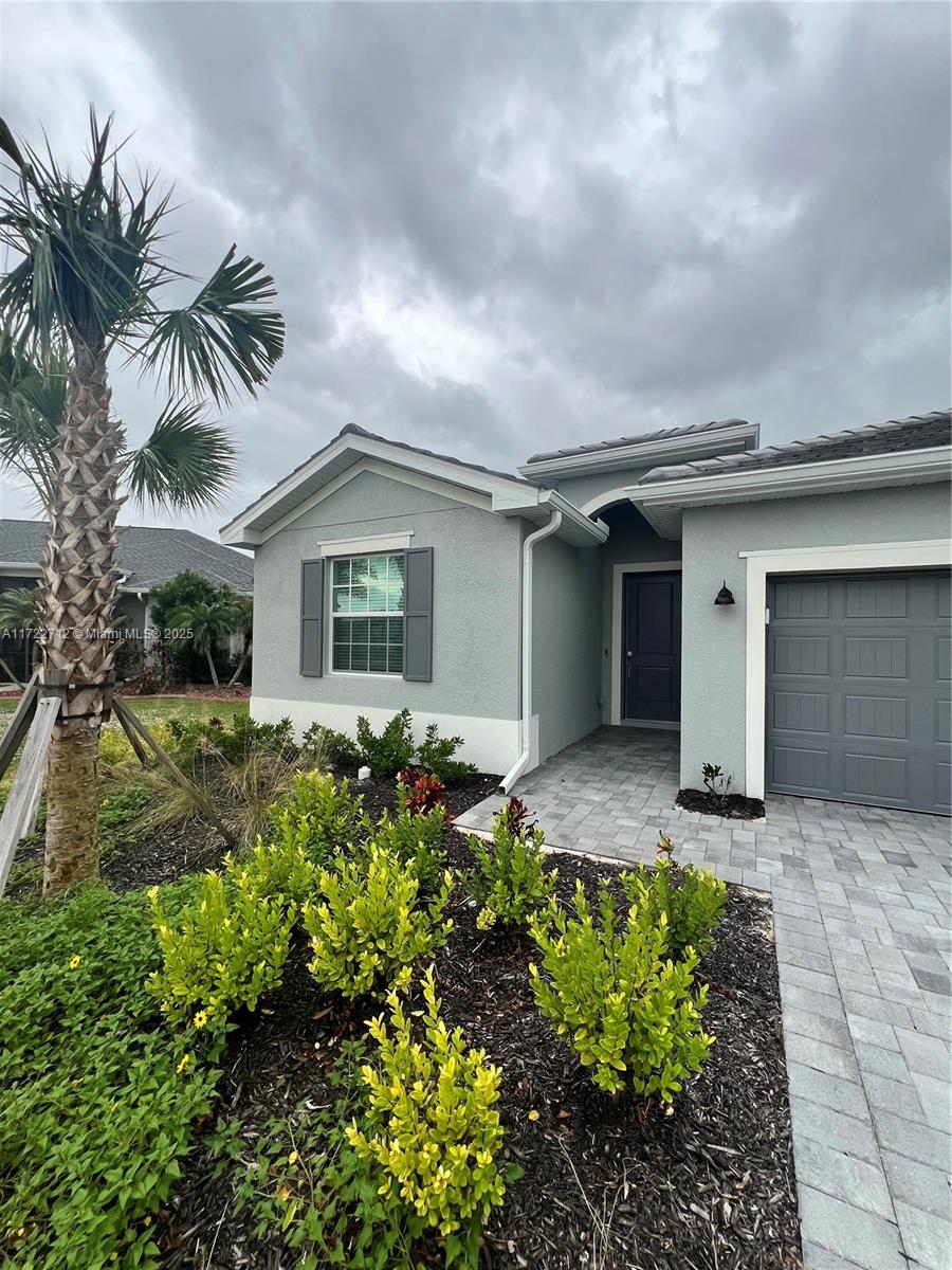 17417 Muscat Lane Punta Gorda, FL 33955 - Photo 2 of 13 front view of a house with a yard