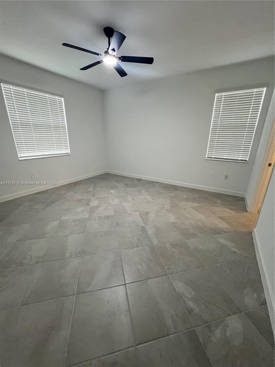 17417 Muscat Lane Punta Gorda, FL 33955 - Photo 7 of 13 a view of an empty room with a window