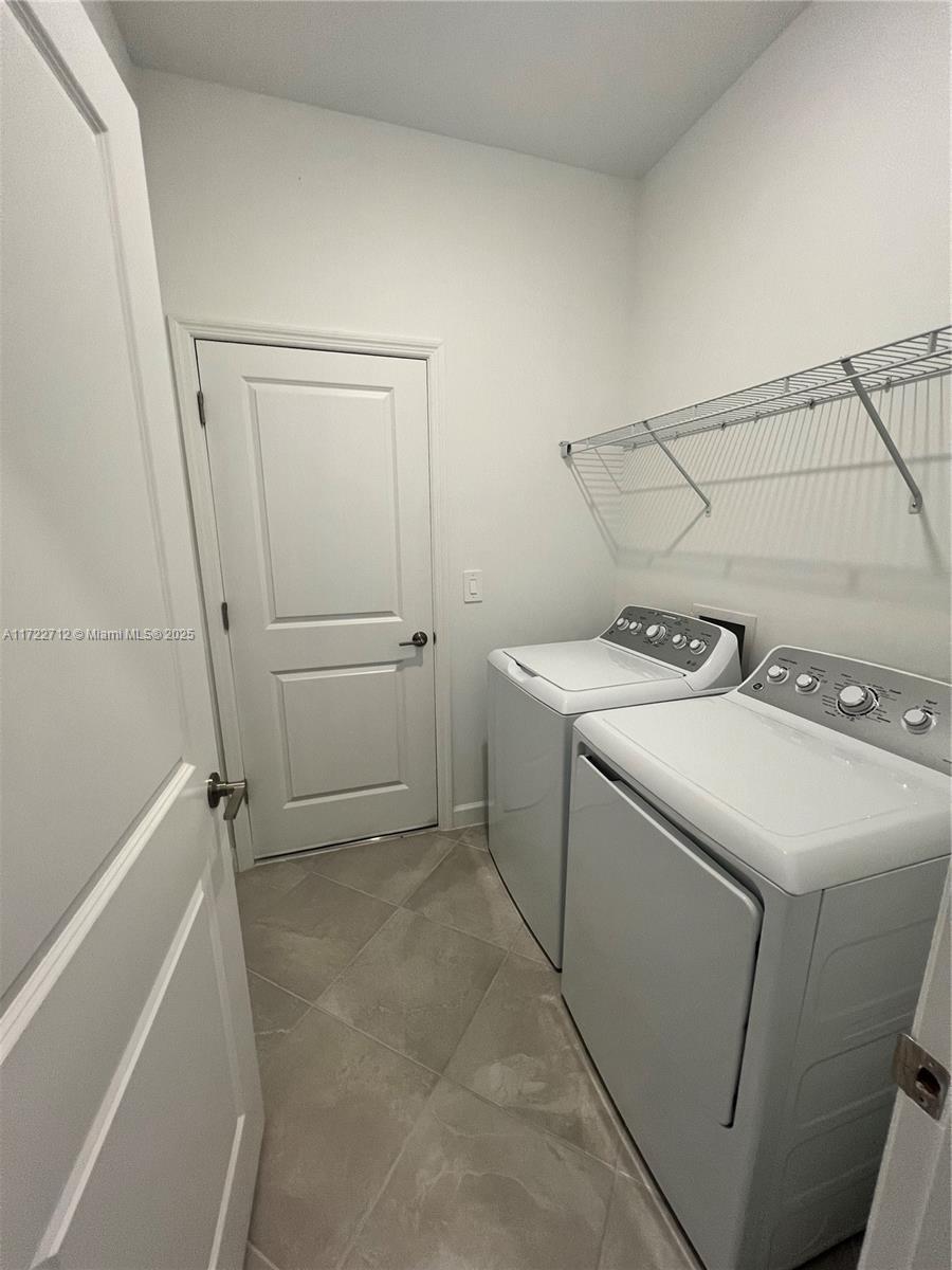 17417 Muscat Lane Punta Gorda, FL 33955 - Photo 9 of 13 a utility room with dryer and washer