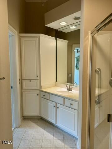 7530 Lead Mine Road, Unit 306 Raleigh, NC 27615 - Photo 19 of 29 a bathroom with a double vanity sink and a mirror
