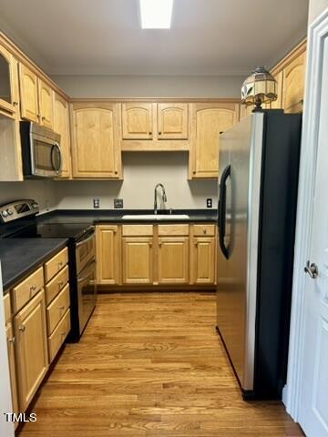 7530 Lead Mine Road, Unit 306 Raleigh, NC 27615 - Photo 5 of 29 a kitchen with stainless steel appliances granite countertop a refrigerator a sink dishwasher a stove and white countertops with wooden floor