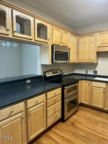 7530 Lead Mine Road, Unit 306 Raleigh, NC 27615 - Photo 6 of 29 a kitchen with granite countertop cabinets stainless steel appliances and a window