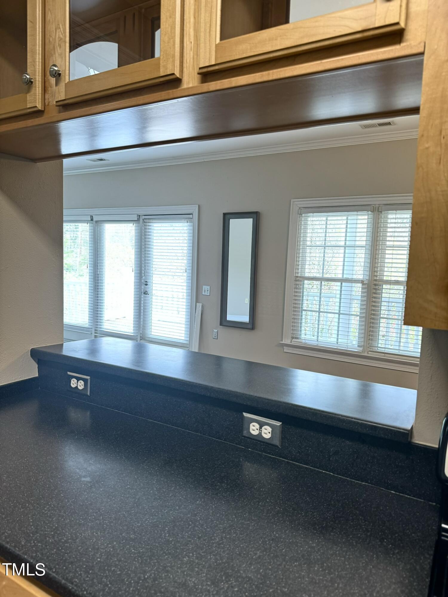 7530 Lead Mine Road, Unit 306 Raleigh, NC 27615 - Photo 9 of 29 a bathroom with a sink and a bathtub next to a window