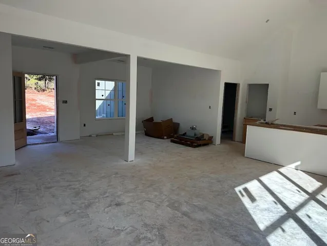 a view of livingroom with furniture and window