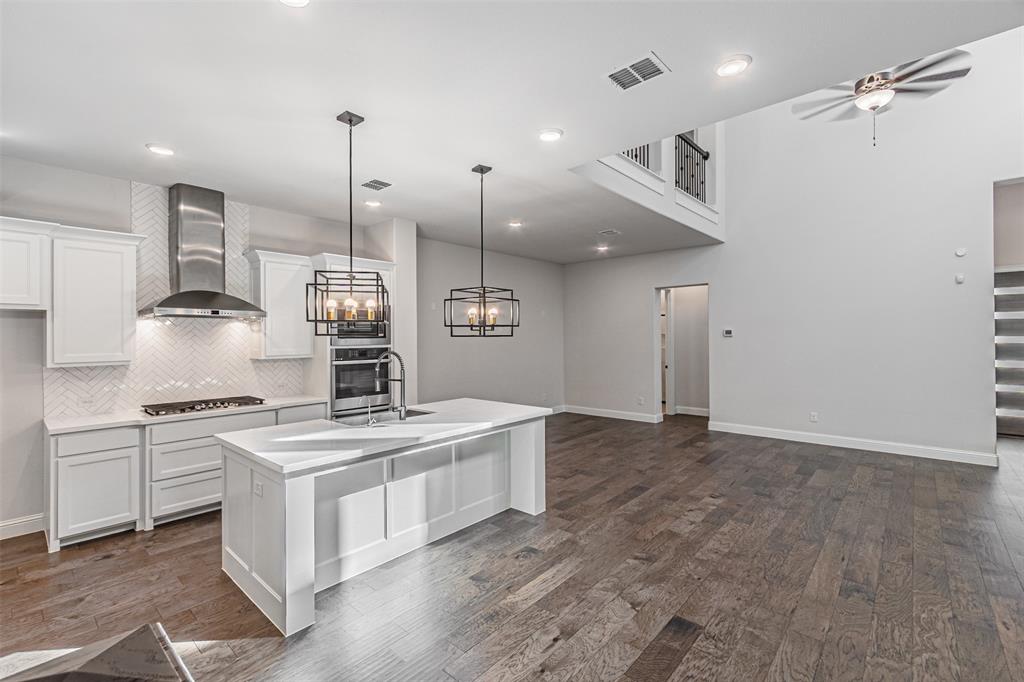 6753 Verandah Way Irving, TX 75039 - Photo 10 of 40 a kitchen with a stove a sink a refrigerator and chairs