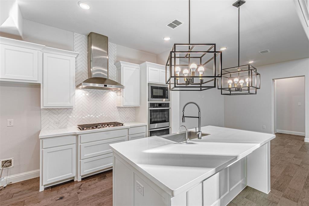 6753 Verandah Way Irving, TX 75039 - Photo 11 of 40 a kitchen with a sink and stove