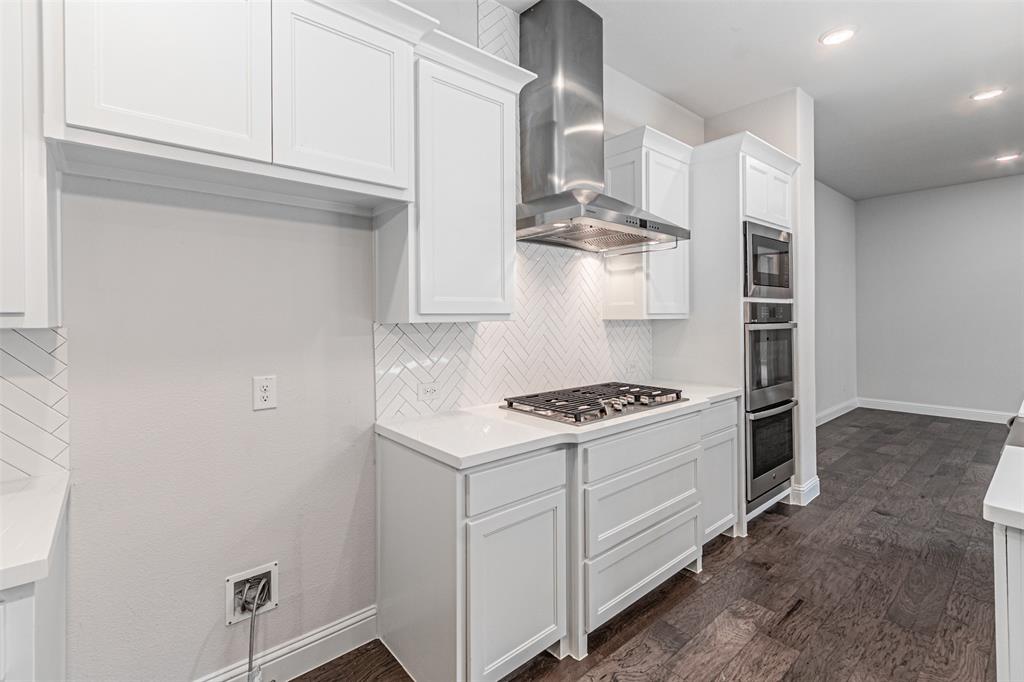 6753 Verandah Way Irving, TX 75039 - Photo 13 of 40 a kitchen with stainless steel appliances granite countertop a sink and a stove