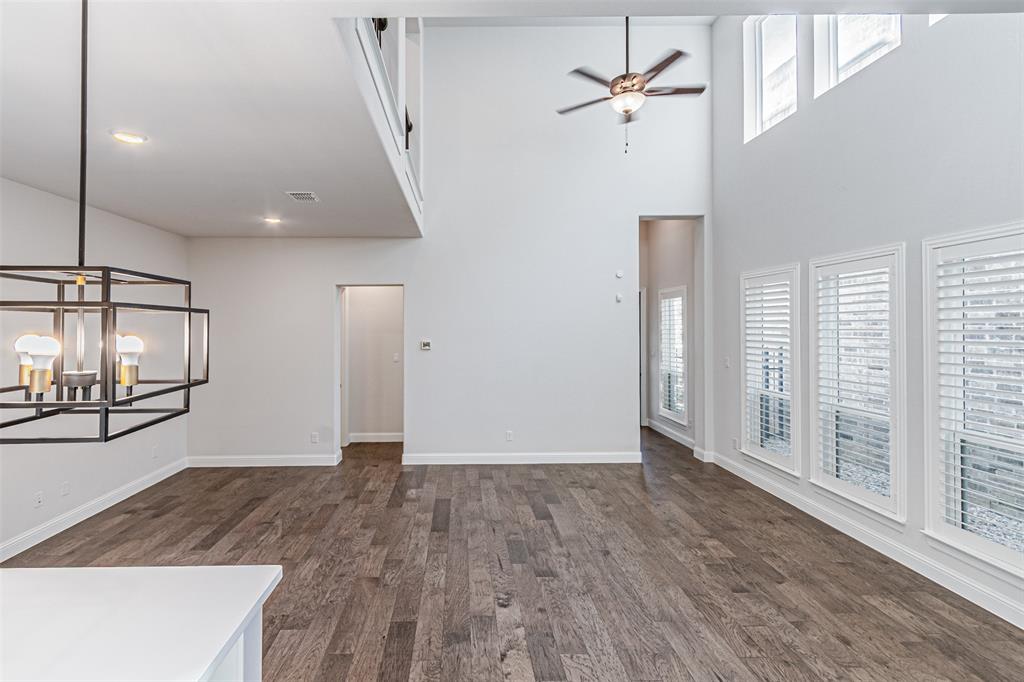 6753 Verandah Way Irving, TX 75039 - Photo 18 of 40 a view of a livingroom with wooden floor