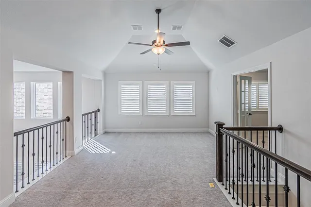 a view of hallway with windows