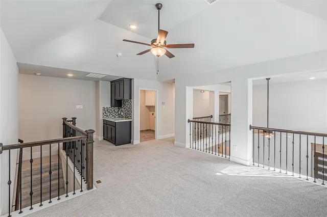 a view of a kitchen with a sink and cabinets