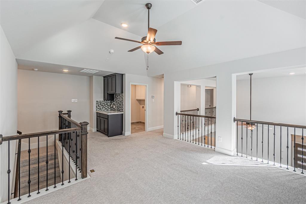 6753 Verandah Way Irving, TX 75039 - Photo 29 of 40 a view of a kitchen with a sink and stainless steel appliances