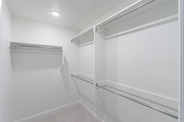 a view of a kitchen with a sink and stainless steel appliances