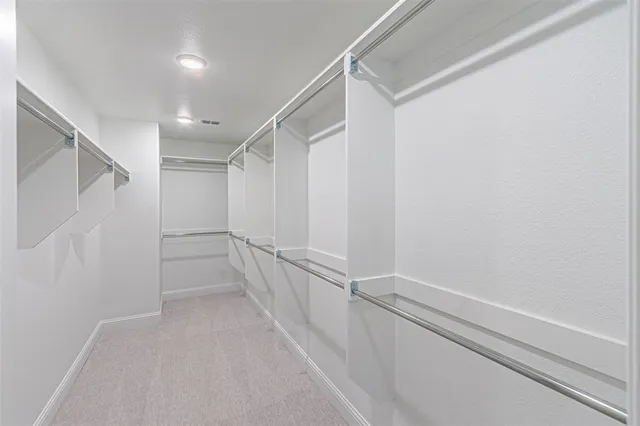 a bathroom with double sink and a mirror