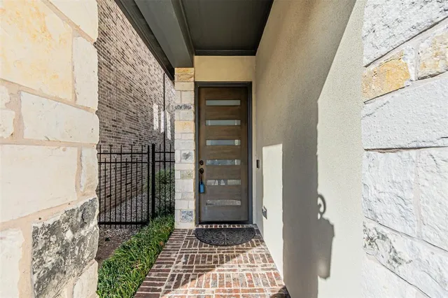 a view of a door and wooden floor