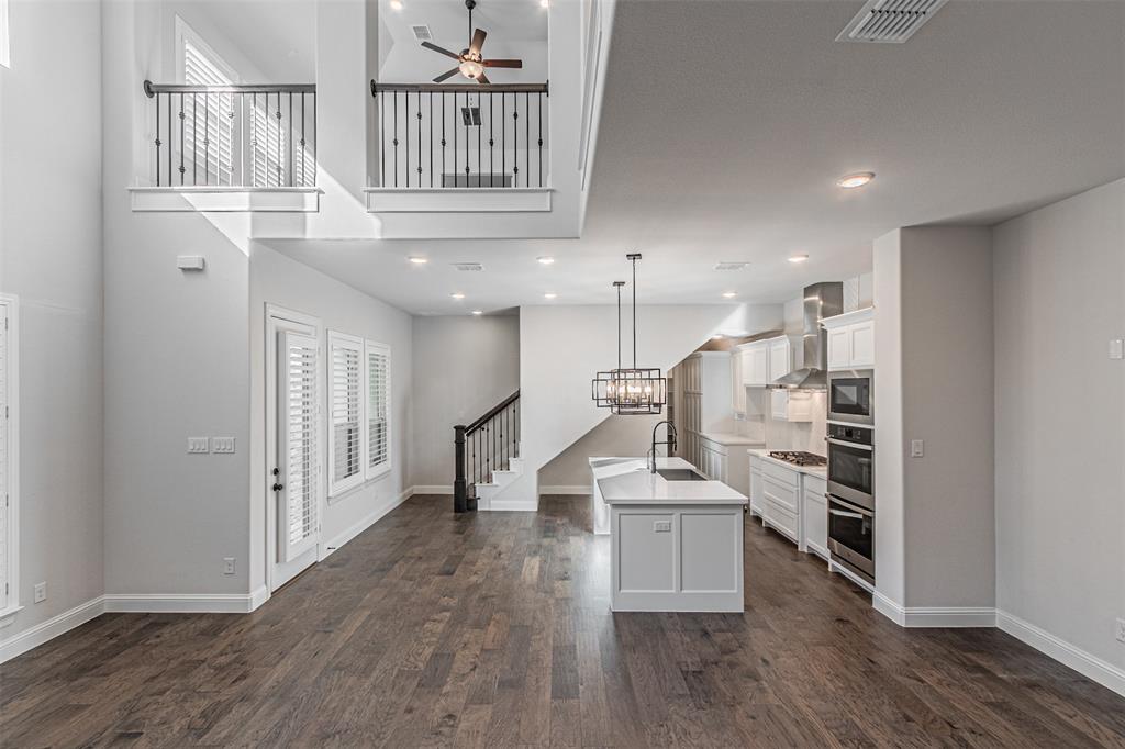6753 Verandah Way Irving, TX 75039 - Photo 7 of 40 a view of kitchen with furniture and wooden floor