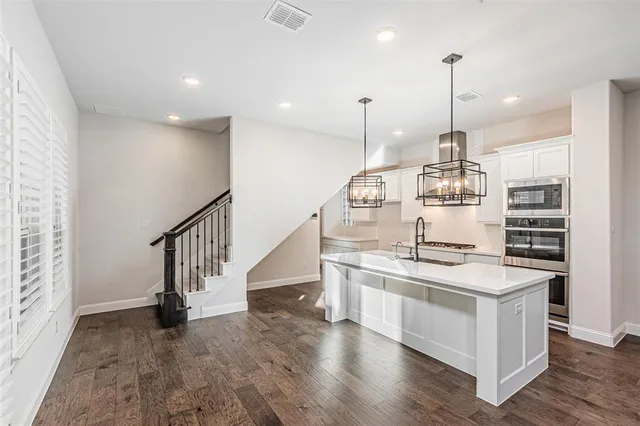 a view of kitchen with furniture and wooden floor