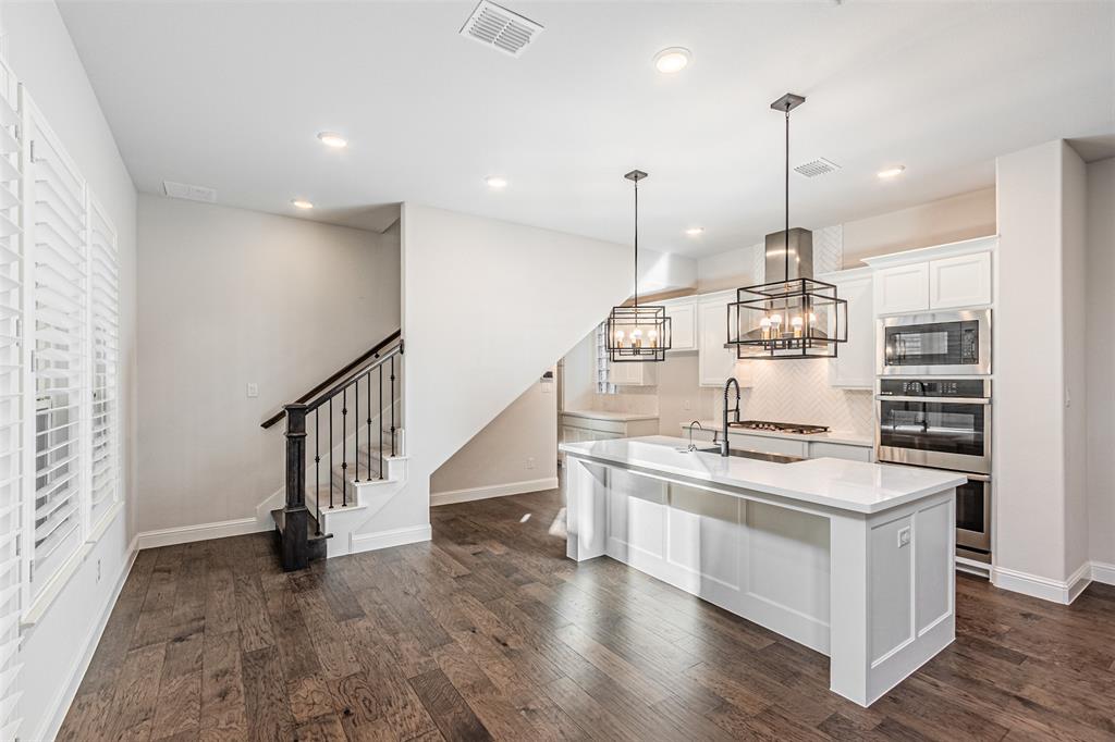 6753 Verandah Way Irving, TX 75039 - Photo 8 of 40 a kitchen with stainless steel appliances granite countertop a stove and a sink